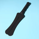 Tantus Trip 2 Tawse Dildo Paddle Whip Black on a blue background showcasing its sleek silicone design.