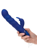 Jack Rabbit Signature Wave Motion Rabbit Vibrator Blue held in hand, showcasing its sleek design and dual-stimulation features.