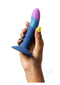 Person holding the ROMP Piccolo non-realistic silicone dildo from the pegging kit