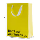 Don't Get Hopes Up Color Gift Bag Yellow featuring a bold message and dimensions for gifting occasions.