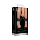 Ouch Velvet Adjustable Ankle Cuffs With Velcro Straps Black packaging featuring model wearing high heels.