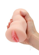 Zolo Stroke Off Porno Pussy Stroker Vanilla held in a hand showcasing its realistic design.