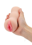 Zolo Stroke Off Super Tight Vibrating Pussy Stroker Vanilla held in hand showcasing its realistic design.