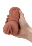 Zolo Stroke Off Porno Pussy Stroker Caramel held in hand showing realistic texture and lifelike design.
