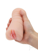 Zolo Stroke Off Vibrating Pussy Stroker Vanilla in hand, showcasing lifelike texture and design for enhanced pleasure.