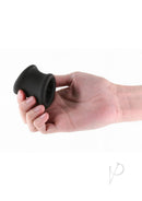 Renegade Suave Silicone Ball Stretcher Cock Ring Black in hand, showcasing its sleek design and soft silicone construction.