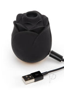 Fifty Shades of Grey Rose Clitoral Suction Stimulator, black, with 10 intense modes, rechargeable, and waterproof, shown with USB cable.