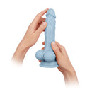 FemmeFunn Vortex Turbo Baller 8.25 inch Rotating Dildo Blue held in hands for demonstration.