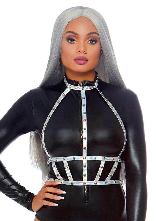 Leg Avenue Iridescent Studded Vinyl Body Harness OS Silver worn by model in a sleek black outfit, showcasing its holographic and studded design.