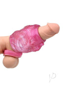 Monstar Beast Silicone Penis Sleeve 14 Pink on a hand showcasing its unique design and ball stretcher feature.