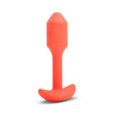 b-Vibe Vibrating Snug Plug 1 Weighted Silicone Anal Plug Orange displayed at an angle on a white background.