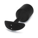 b-Vibe Vibrating Snug Plug 5 Weighted Anal Plug Black displayed on a white background, showcasing its sleek design and control features.