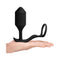 b-Vibe Vibrating Snug and Tug Weighted Anal Plug XL Black shown in hand for scale.