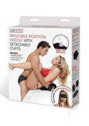 Lux Fetish Inflatable Position Wedge with Detachable Cuffs packaging featuring a couple demonstrating the product.