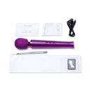 Le Wand Petite Rechargeable Massager Dark Cherry with accessories and user guide on a white background.