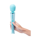 Le Wand All That Glimmers Petite Massager Set Light Blue held in hand, showcasing its stylish design and compact size.