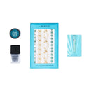 Le Wand All That Glimmers Petite Massager Set Light Blue with metallic temporary tattoos and glitter body gel displayed.