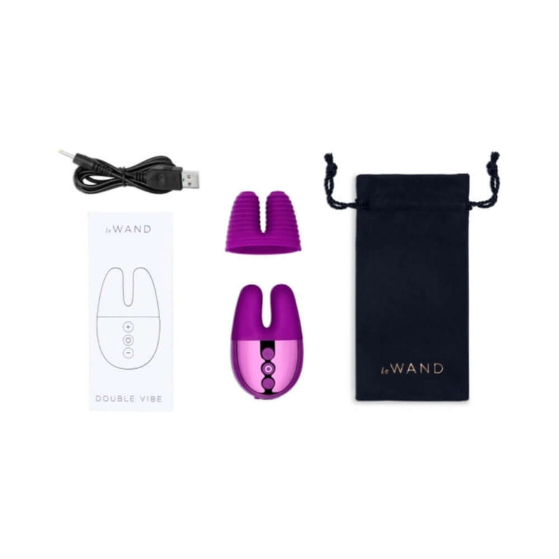 Le Wand Chrome Double Vibe Mini Vibrator Dark Cherry with USB charger, user manual, and storage pouch.