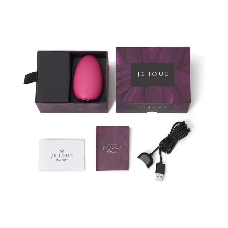 Je Joue Mimi Soft Silicone Clitoral Vibrator Fuchsia in packaging with accessories and charging cable.