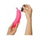 Love To Love Oh Oui Silicone Banana Vibrator Pink held in one hand with a small vibe in the other hand.