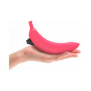 Love To Love Oh Oui Silicone Banana Vibrator Pink held in hand, playful fruit-inspired design for intimate pleasure.