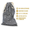 The Collection Bomba Cotton Toy Storage Bag featuring a black and white design, drawstring closure, and made from 100% natural cotton.