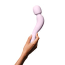 Dame Com Rechargeable Silicone Wand Vibrator Quartz held in a hand showcasing its ergonomic design.