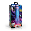 Creature Cocks Astro Cock Vibrating Glow-in-the-Dark Dildo packaging with cosmic theme and vibrant colors.