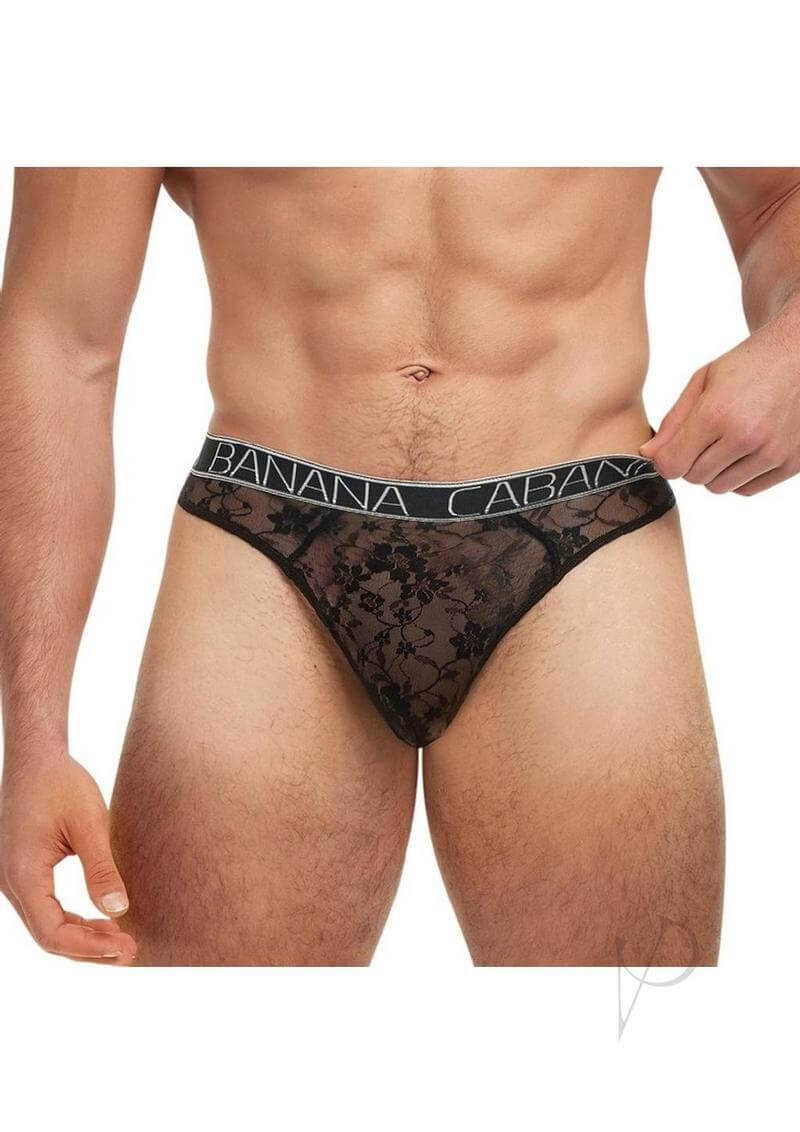 Banana Cabana Lace Nights Thong Small Medium Black on a male model showcasing sheer lace design and comfortable fit.