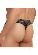 Male model wearing Banana Cabana Lace Nights Thong Small Medium Black showcasing sheer lace design.