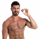 Sport Fucker Pentagon Silicone Cock Ring held by a man showcasing its sleek design and comfortable fit.