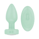 Luv Inc Pr17 Vibrating Butt Plug With Remote Green beside its remote control, showcasing body-friendly design.