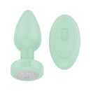 Luv Inc Pr17 Vibrating Butt Plug With Remote Green alongside its remote control.