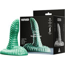 Tentra Zoryn Alien Tail Rotating Grinder Vibrator Green on display with packaging.