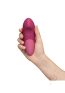 Womanizer Vibe Dusky Pink clitoral vibrator with UltraWave technology in hand