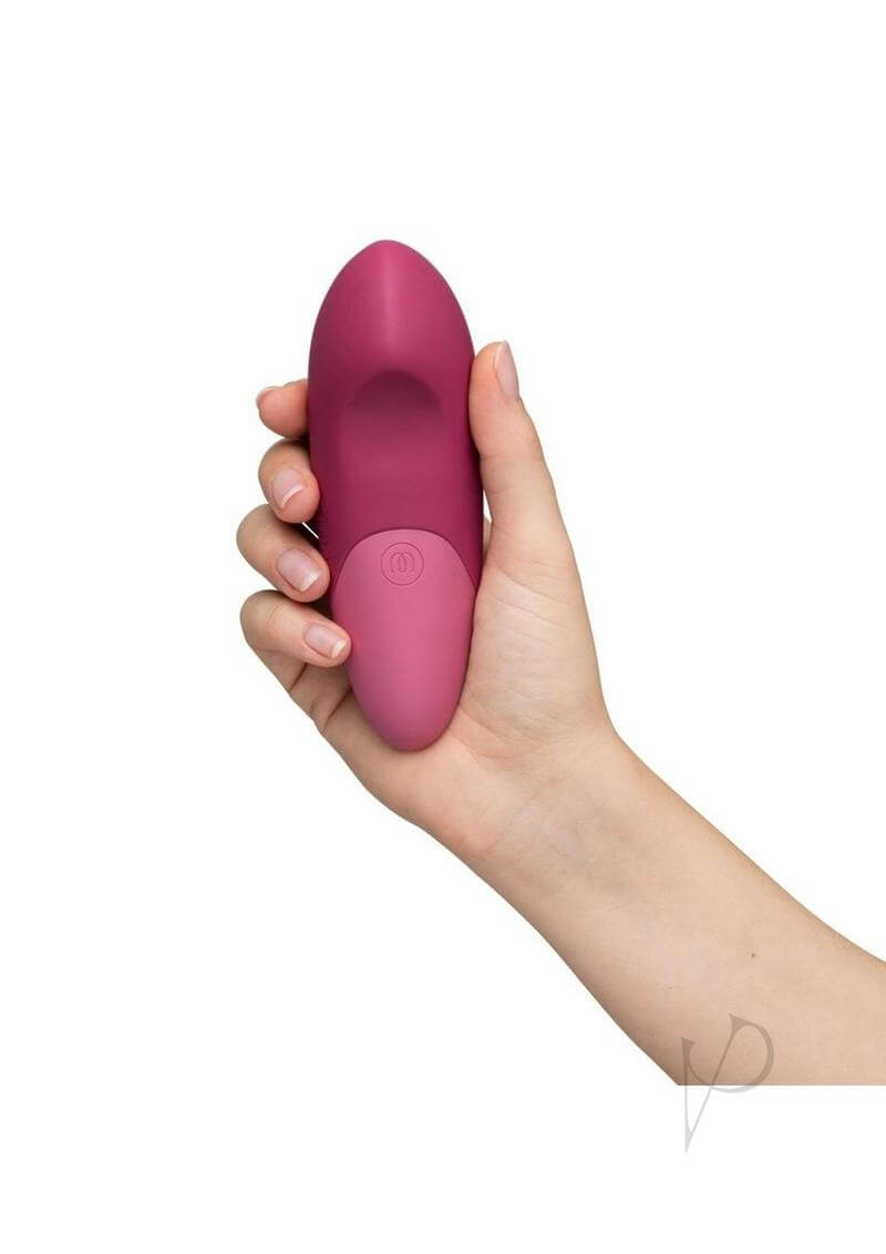 Womanizer Vibe Dusky Pink clitoral vibrator with UltraWave technology in hand