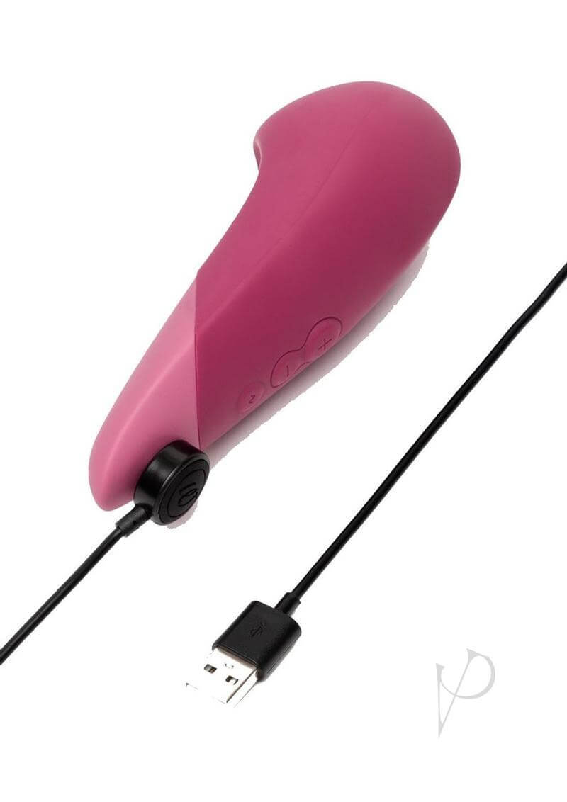 Dusky pink Womanizer Vibe clitoral vibrator with UltraWave technology and USB charging cable.