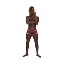 Male Power Sport Mesh Sport Mini Short Burgundy Large modeled by a muscular man, showcasing sporty and breathable design.