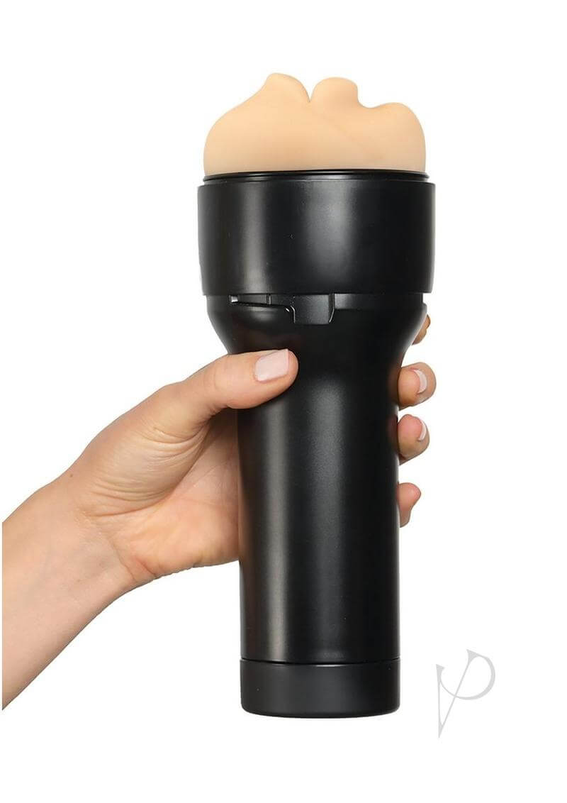 Hand holding Kiiroo Feel Stroker Mouth, a gender-neutral pleasure device in black, designed for universal, intimate enjoyment.