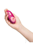 Hand holding Womanizer Liberty 2 Special Edition Pink clitoral stimulator, Iggy Azalea collaboration.
