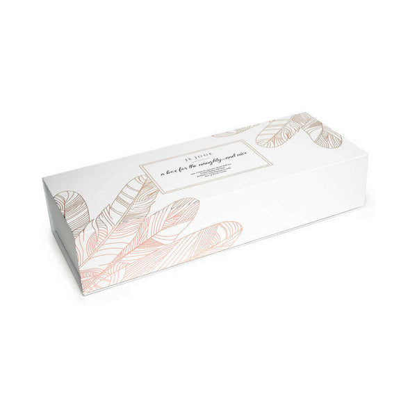 Je Joue The Naughty and Nice Collection beautifully packaged in a rose gold feather design gift box.