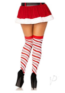 model wearing peppermint striped over-the-knee socks with a red skirt and high heels, perfect for holiday parties.