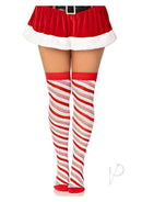 Peppermint striped over-the-knee socks in red and white worn with a festive Santa skirt, perfect for holiday parties.