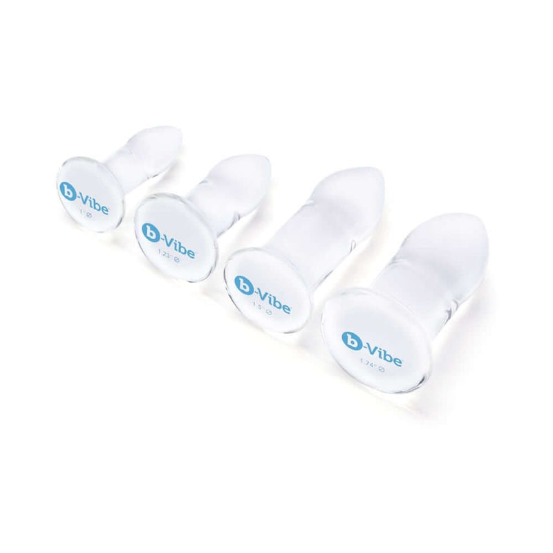 b-Vibe 4 Piece Anal Dilators Glass Plug Set featuring four smooth glass plugs of varying sizes.