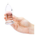 b-Vibe 4 Piece Anal Dilators Glass Plug Set held in hand, showcasing its elegant design and body-safe material.