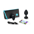 b-Vibe Remote-Controlled Anal Plug XX-Large with travel pouch, remote, USB cable, and instruction guide.