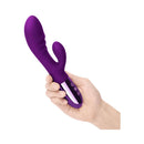 Le Wand Blend Double Motor Rabbit Vibrator Dark Cherry held in hand, showcasing its design and features.