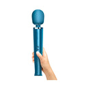 Le Wand Rechargeable Vibrating Massager Pacific Blue held in hand, showcasing its elegant design and features.