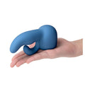 Le Wand Petite Dual Weighted Silicone Attachment displayed in a hand, showcasing its ergonomic design and premium material.