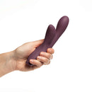 Je Joue Hera Rechargeable Silicone Rabbit Vibrator Purple held in hand for perspective.
